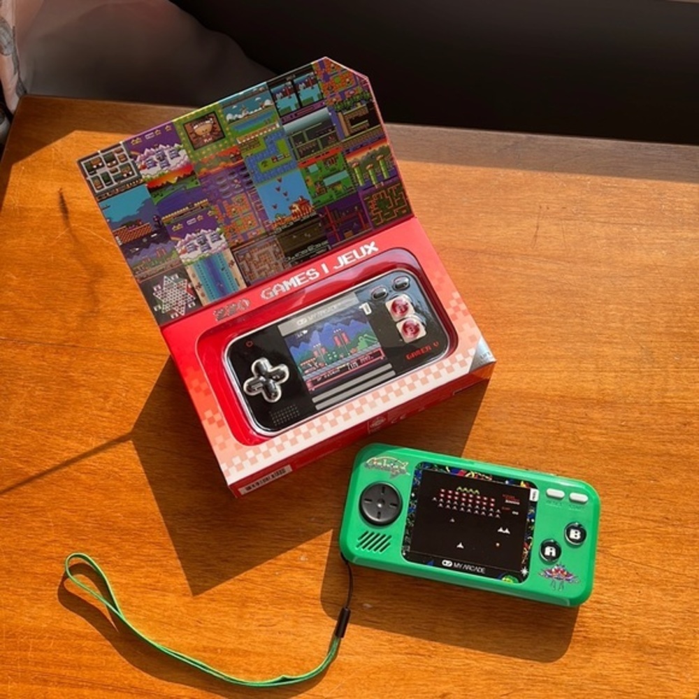 Two hand held games. One Galaga and one is 220 Retro games.